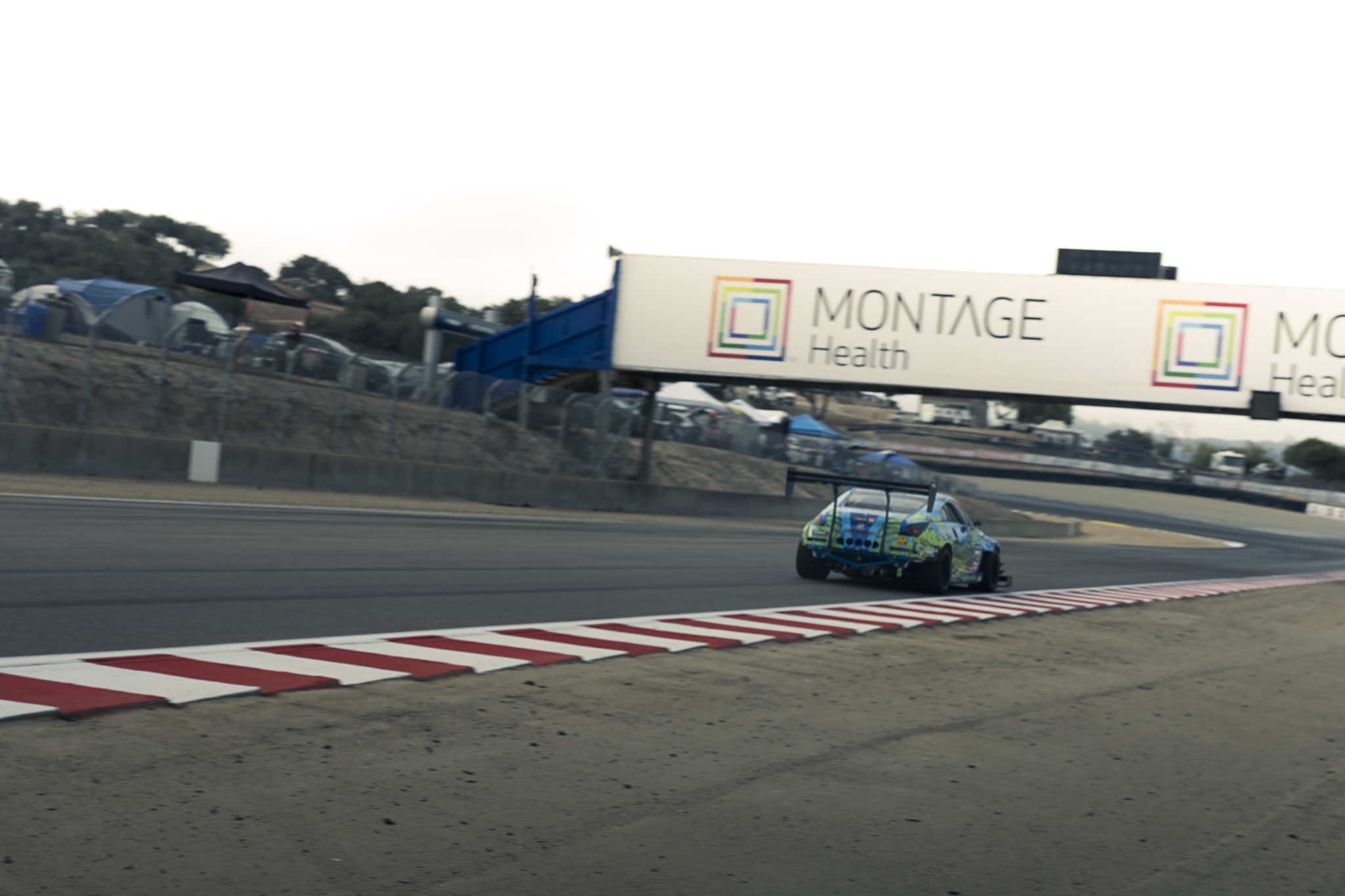 A race car descends the Corkscrew at Laguna Seca.