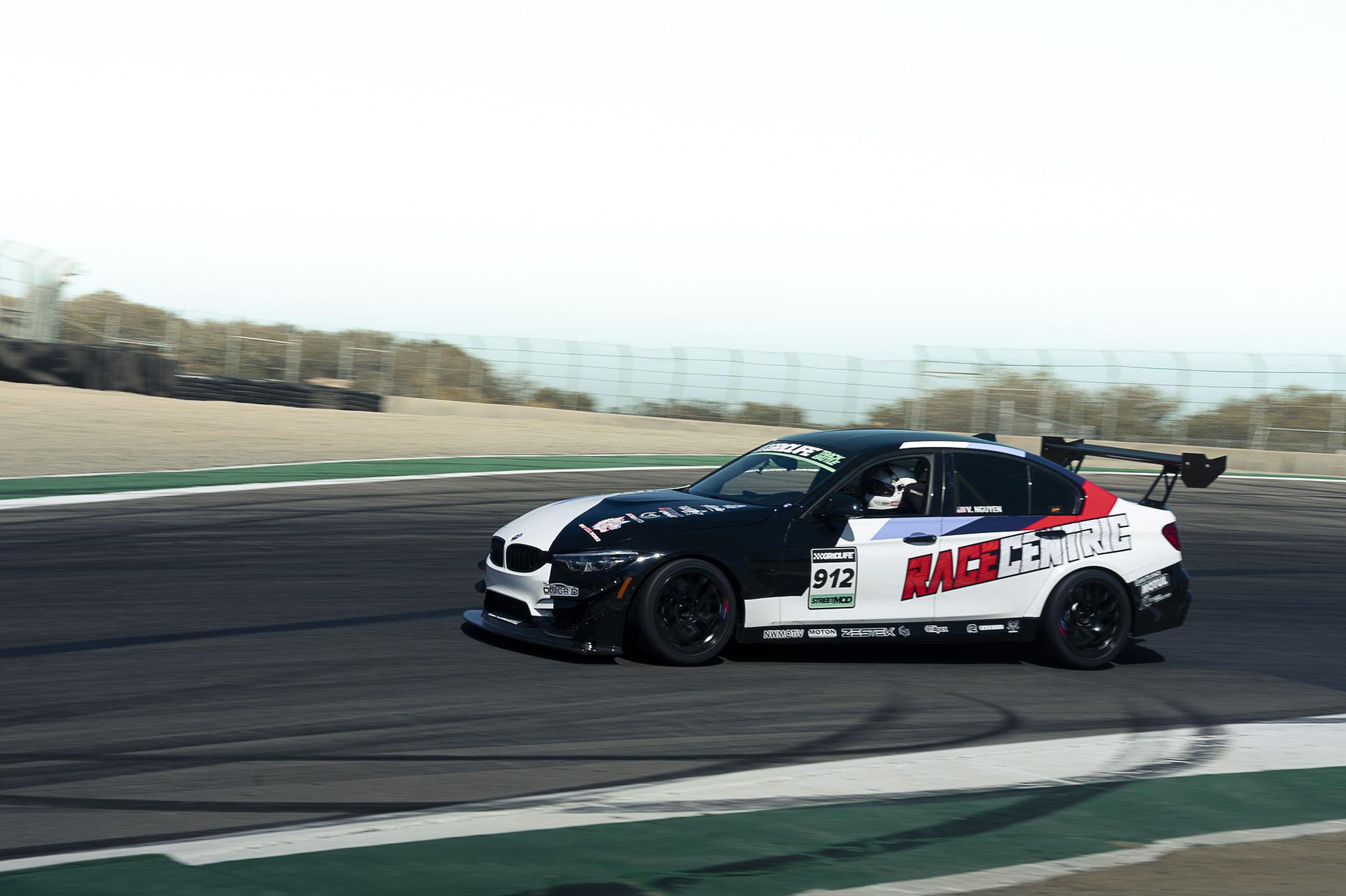 Two drift cars run side by side at GRIDLIFE Laguna Seca.